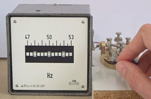 reed frequency meter, showing 48 and 52 Hz sidebands